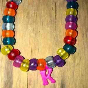 Multi color beads. Letter K.